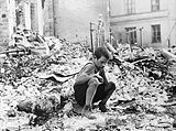 https://upload.wikimedia.org/wikipedia/commons/thumb/9/91/Polish_kid_in_the_ruins_of_Warsaw_September_1939.jpg/160px-Polish_kid_in_the_ruins_of_Warsaw_September_1939.jpg